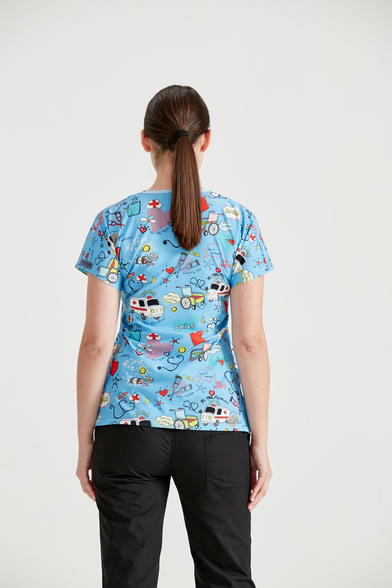 Asistenta medicala imbracata in bluza medicala de dama, cu elastan, Ambulance Turquoise, vedere din spate