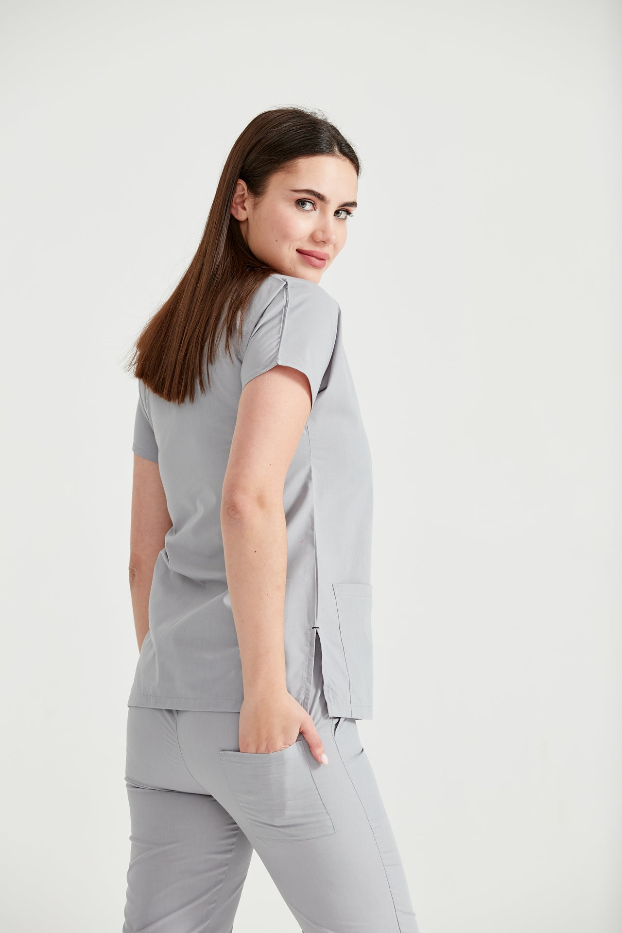 Asistenta medicala imbracata in costum medical gri Light Grey, vedere din spate