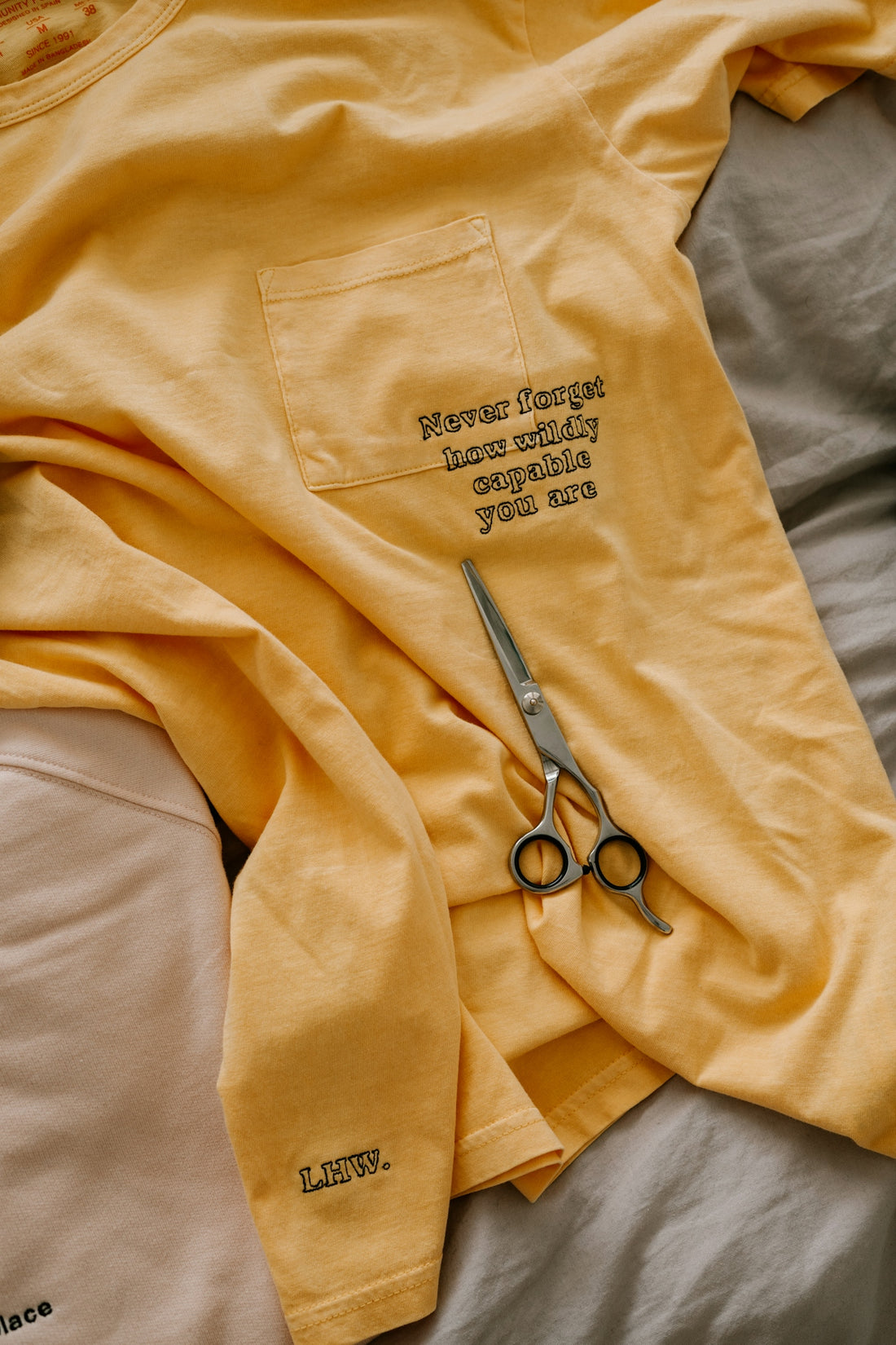 black and silver scissors on brown textile
