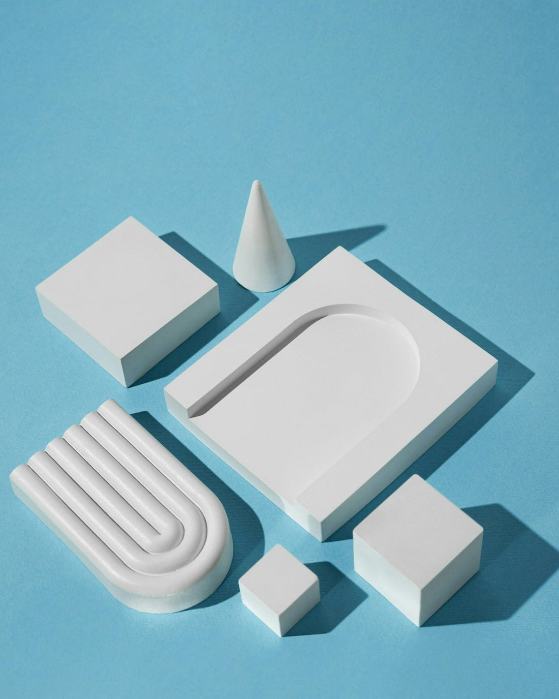 a set of white objects on a blue surface