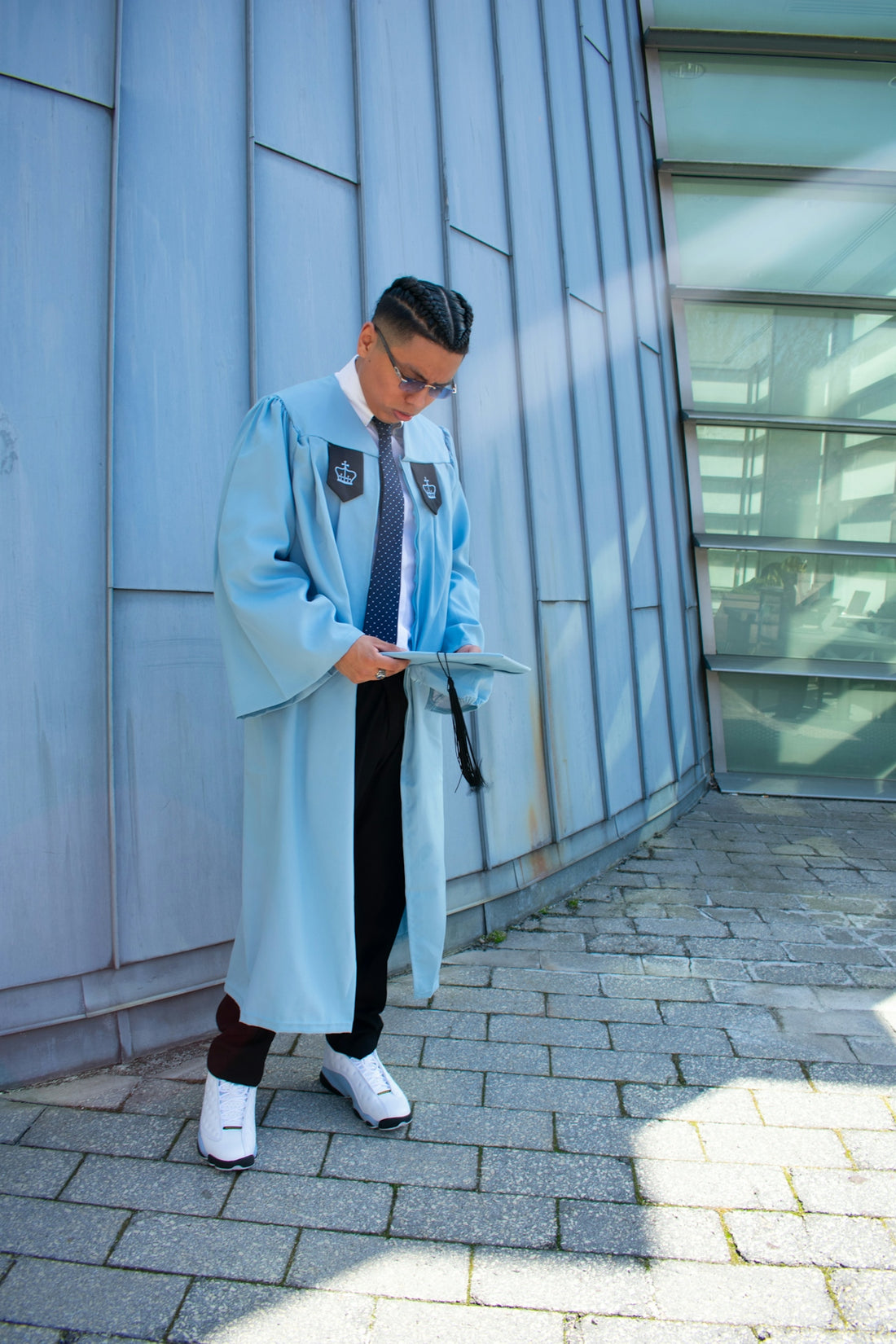 A man in a blue coat is looking at a piece of paper