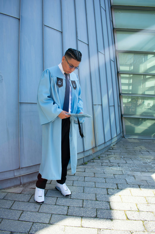A man in a blue coat is looking at a piece of paper
