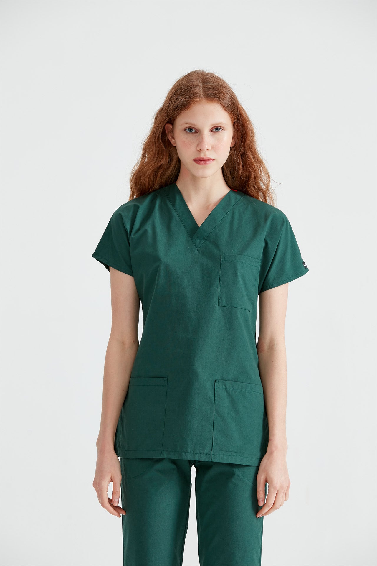 Asistenta medicala imbracata in costum din elastan verde Green, vedere din fata